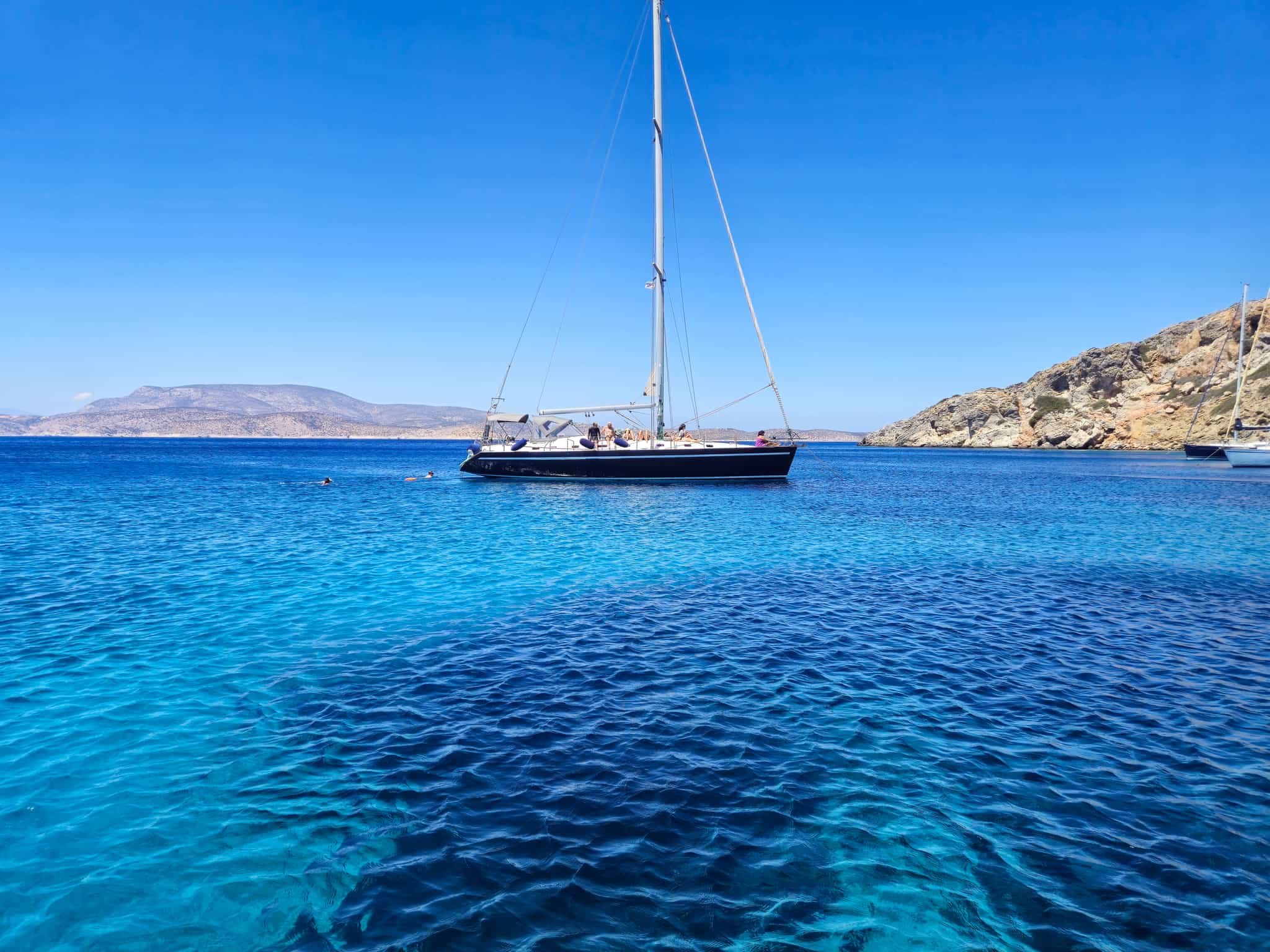 Sailboat in a turquoise lagoon in Greece