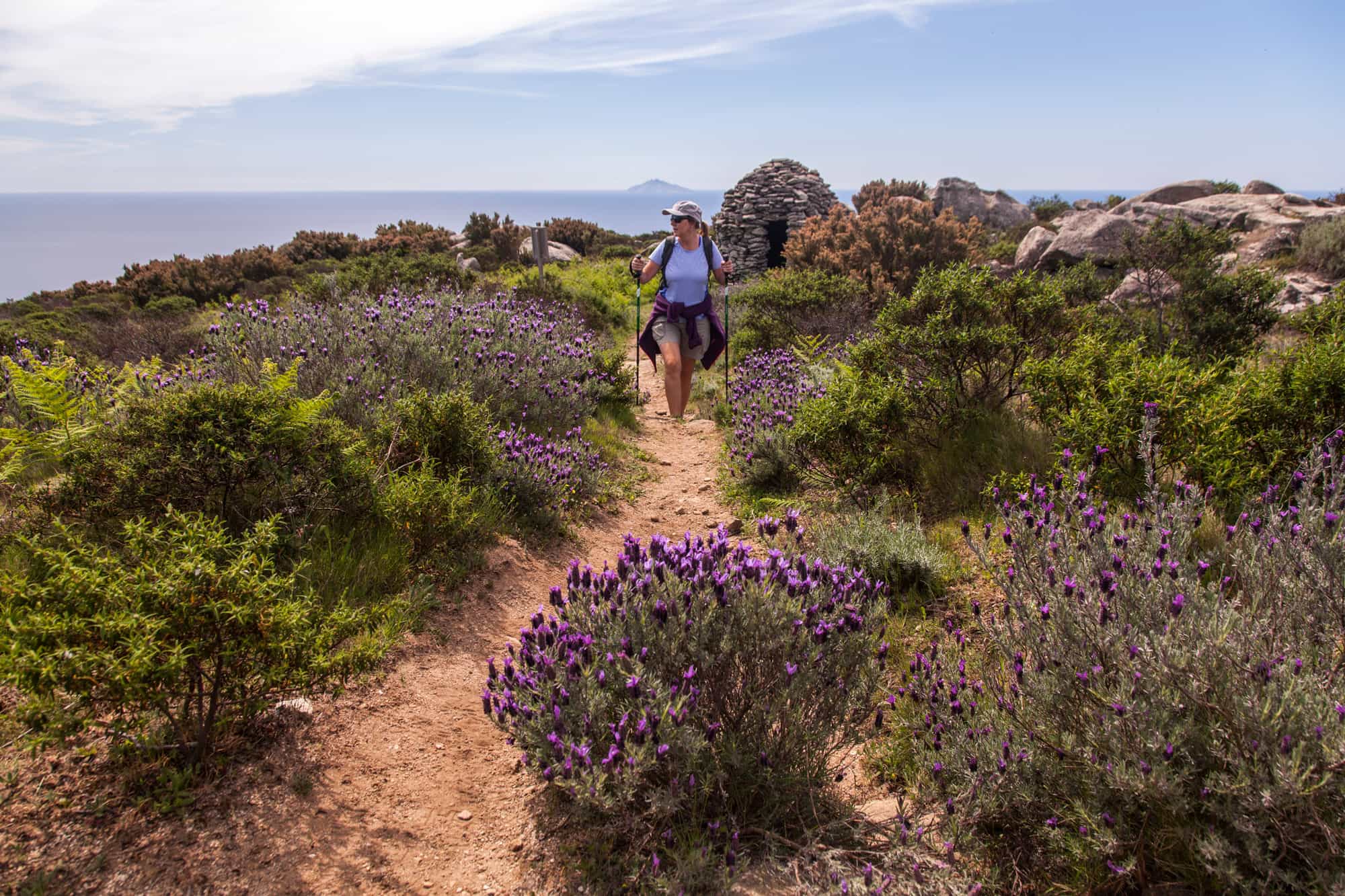 Hiker on Stage 5 of the GTE trail in Elba, Italy.