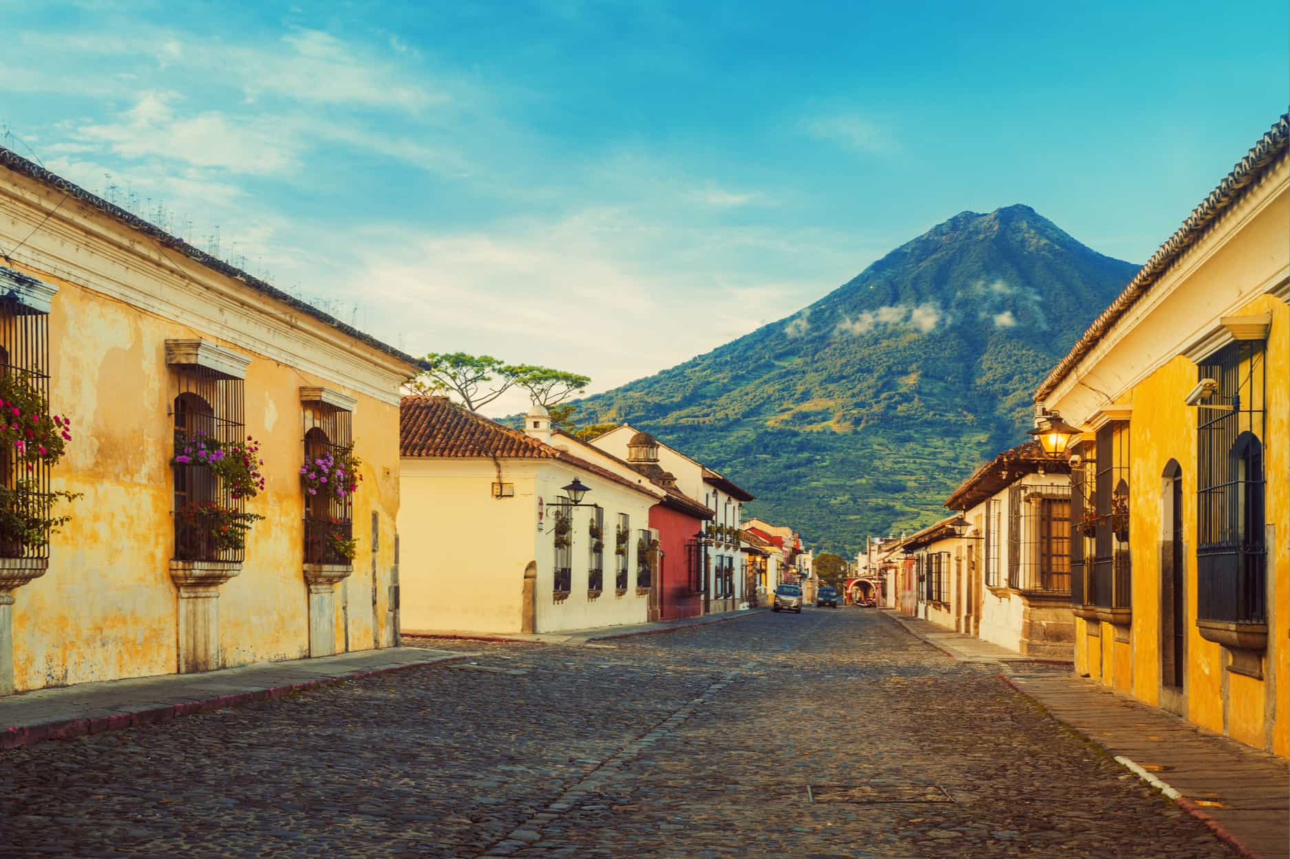 Antigua Guatemala, classic colonial town with famous Arco de Santa Catalina and Volcan de Agua behind