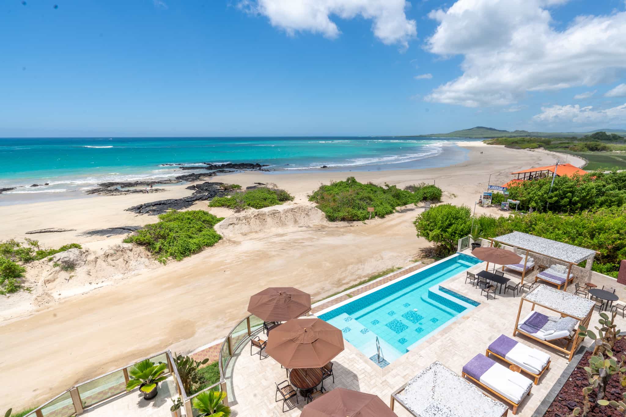 Panorama of Iguana Crossing Hotel's pool and beach area, Galapagos