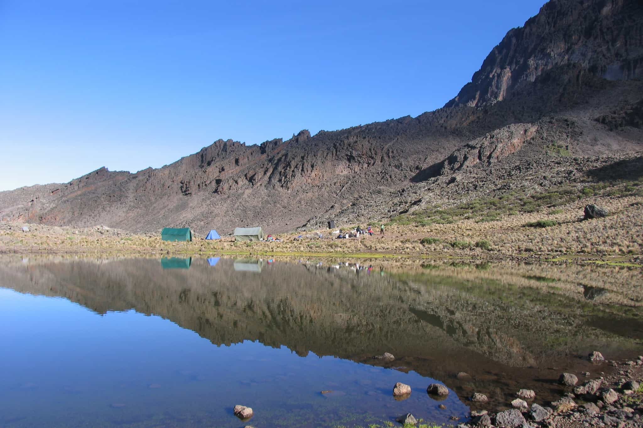 Mawenzi peak reflected in Mawenzi Tarn on the Rongai Route, Mount Kilimanjaro.