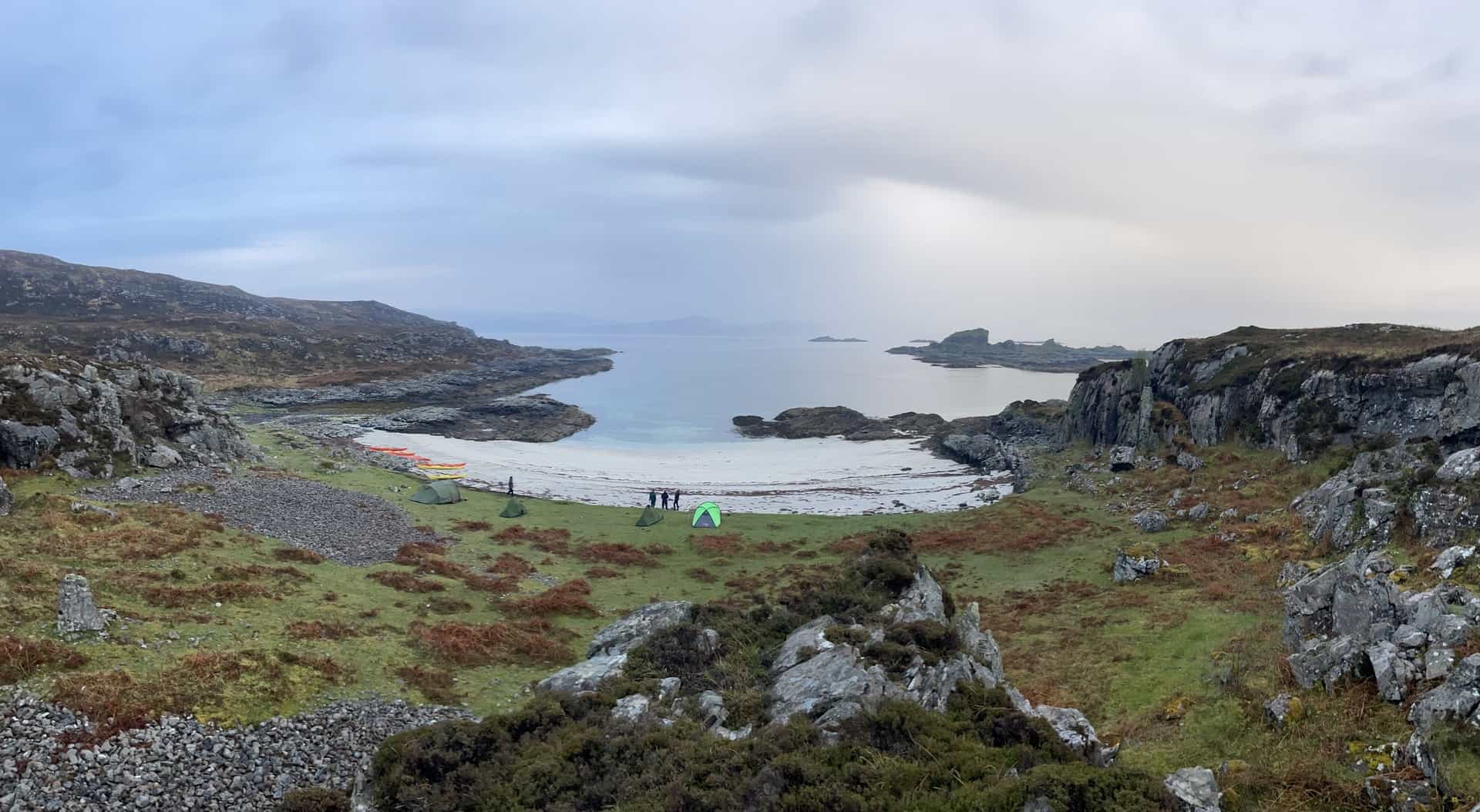 Wild camp setup with kayaks on the West Coast of Scotland.