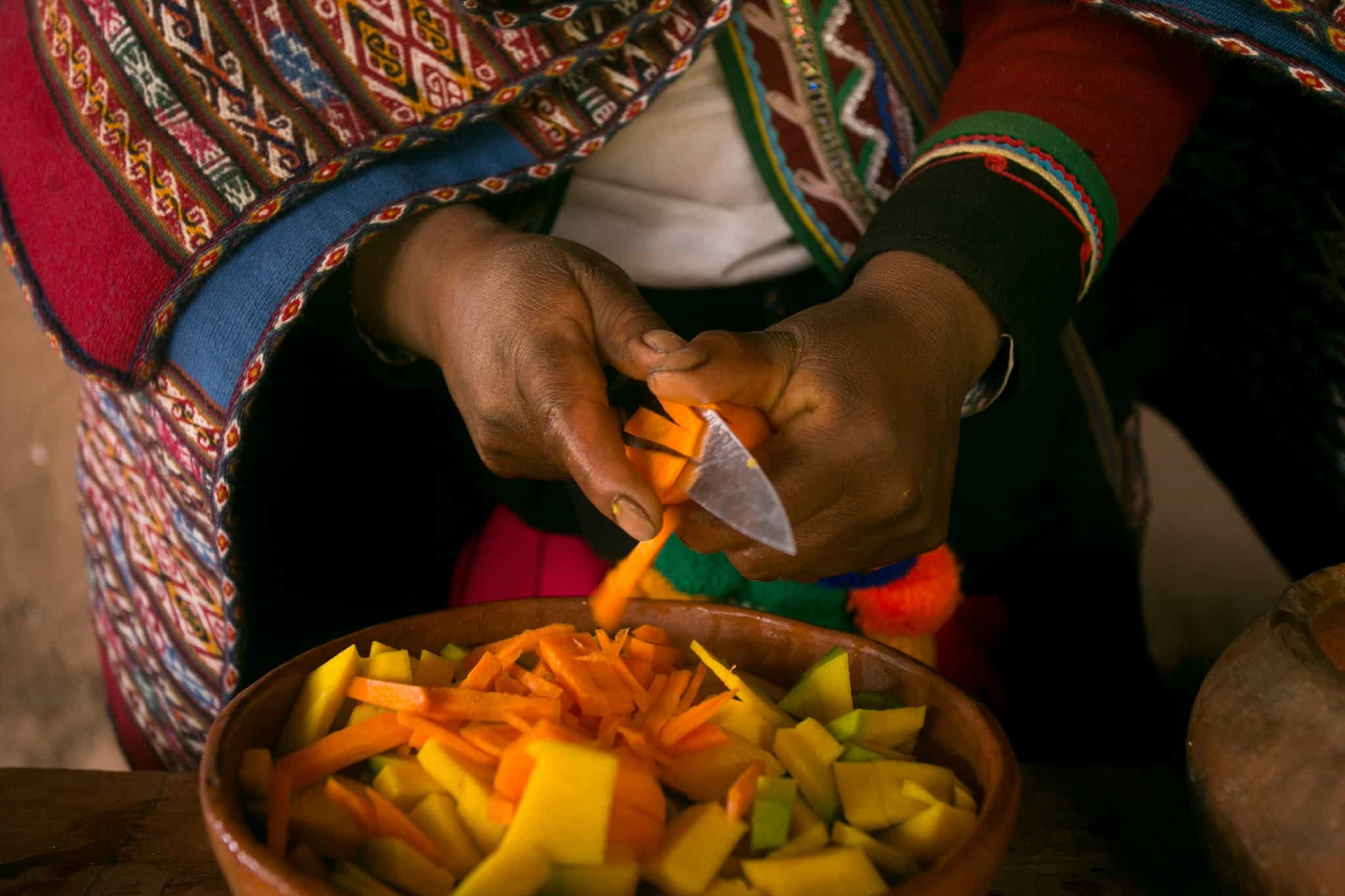 Cooking a traditional Andean vegetable soup before a Pachamanca feast in the Sacred Valley, Peru