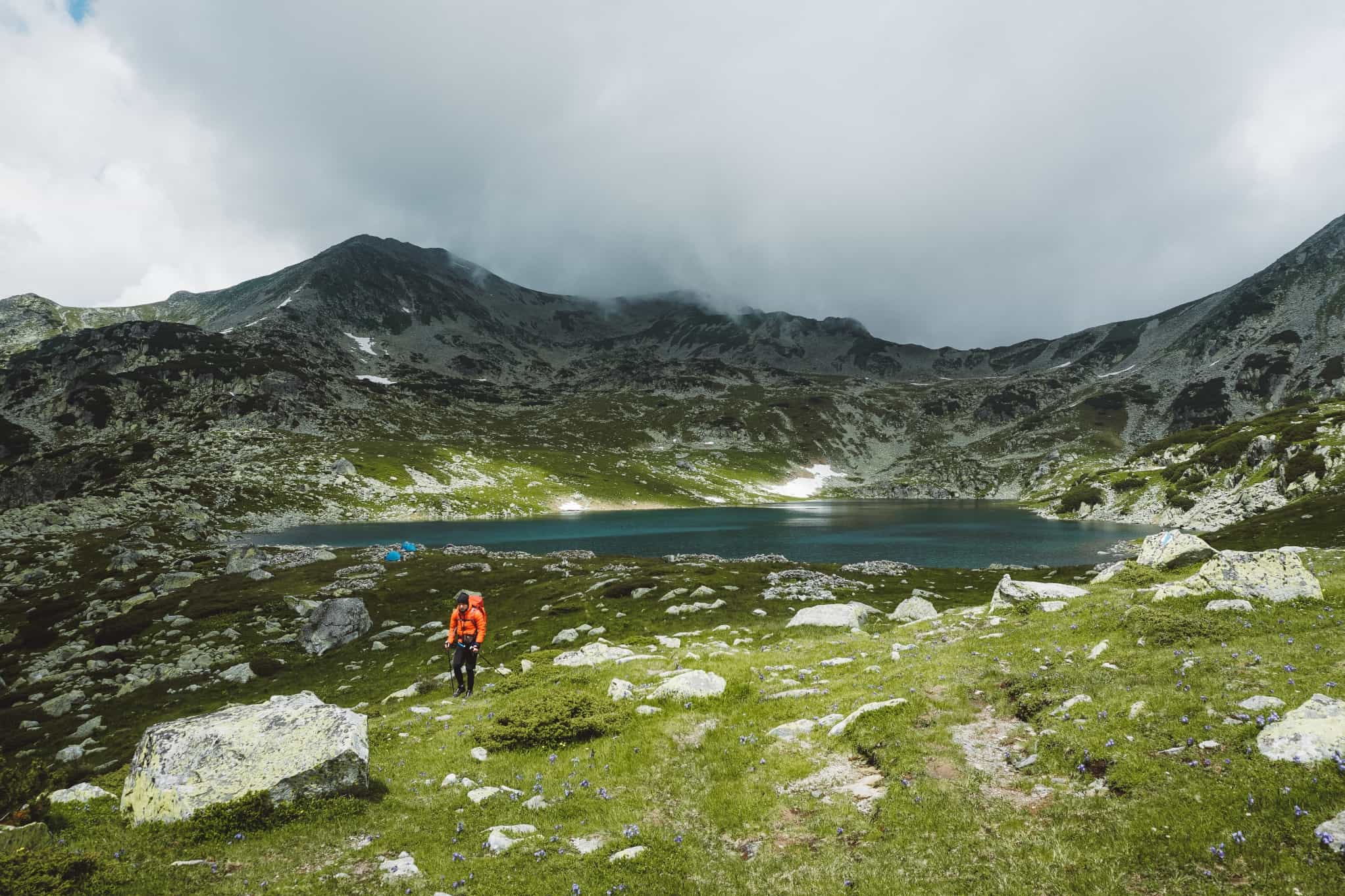 A hiker near Bucura Lake in Romania's Retezat Mountains.