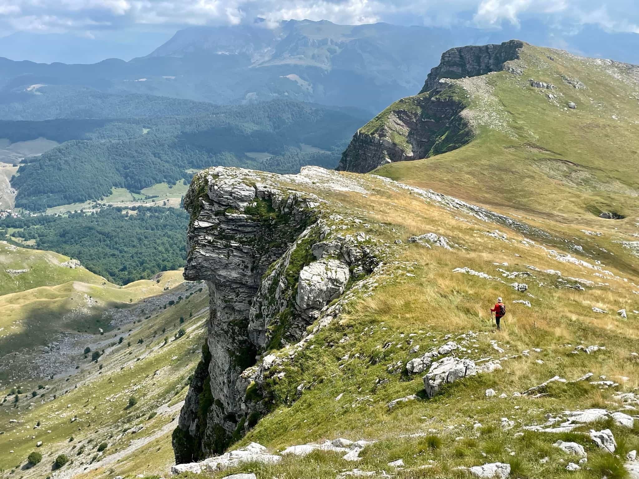 Hiker walking along a ridge of the Visocica Mountains in Bosnia