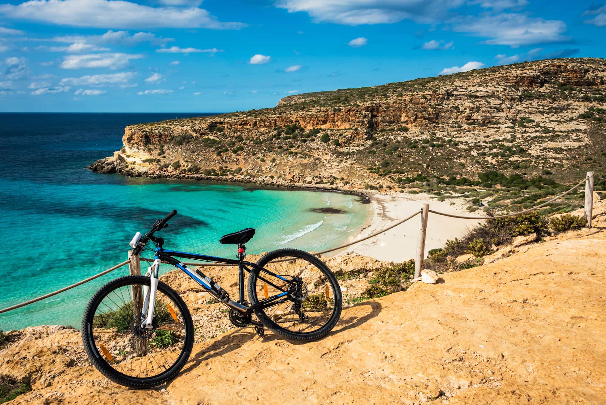 Bike with view of Sicily coastline & beach