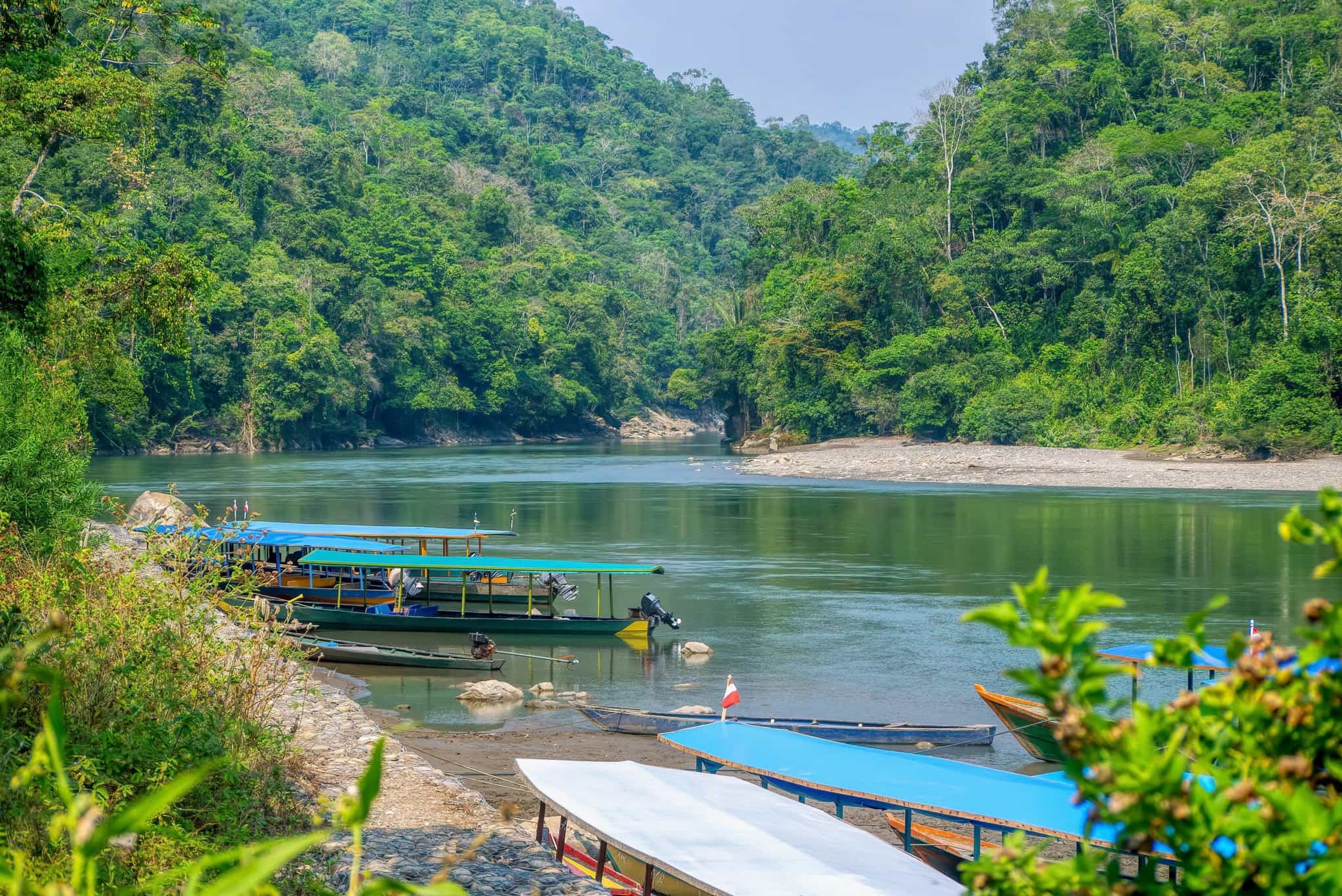 Wooden boats on the Madre de Dios River in the Peruvian Amazon