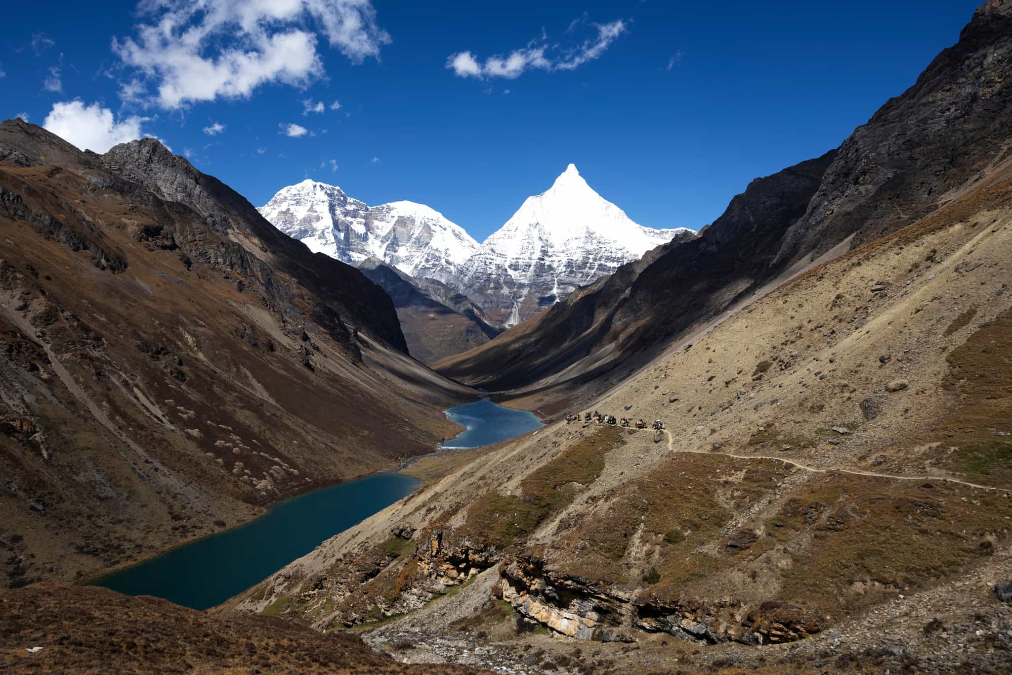Lookout over the Jimi langtsho lake in Bhutan, with Jomolhari in the distance.