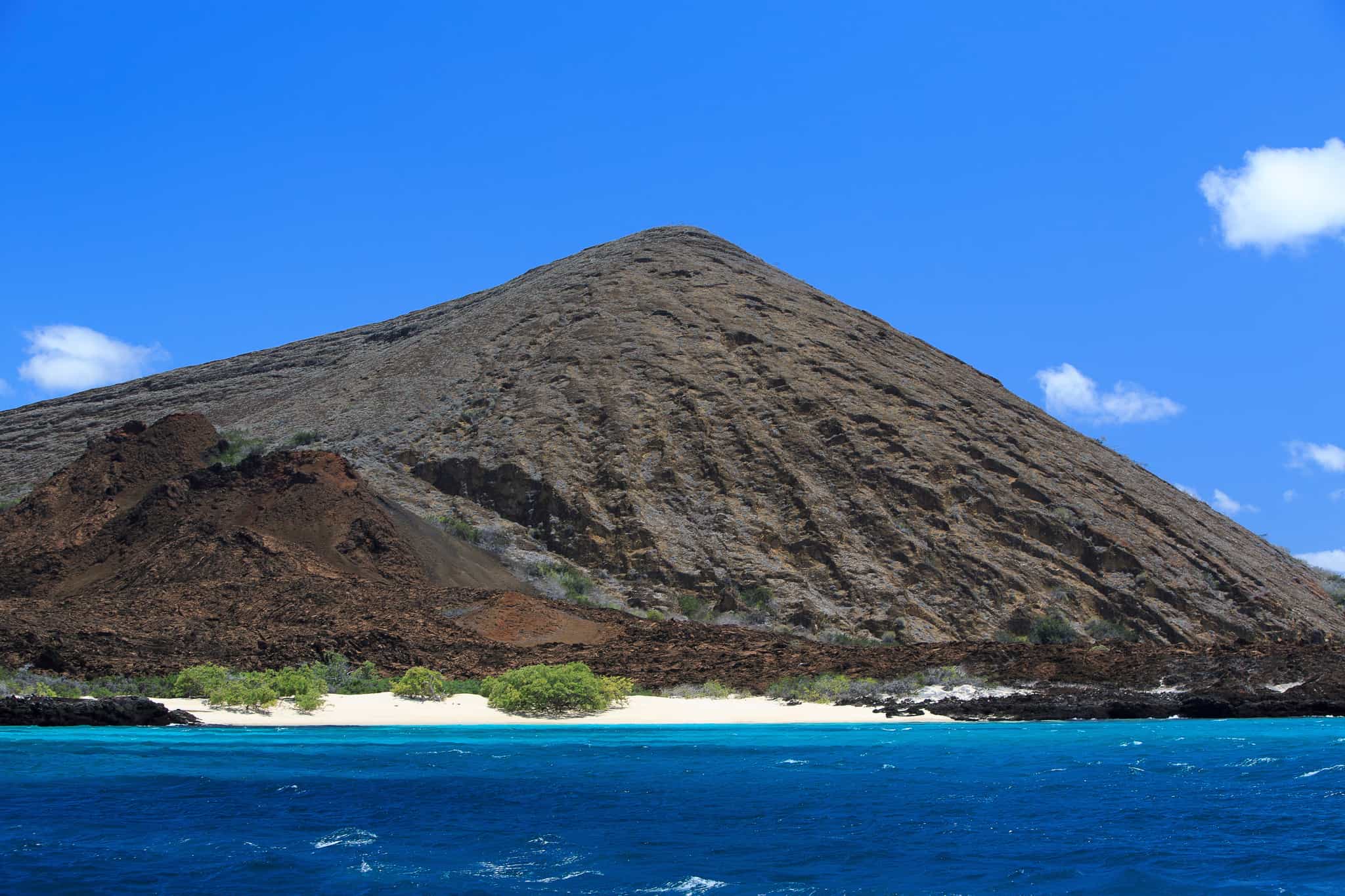Volcanic island rising out of the Pacific Ocean in the Galapagos Islands, Ecuador.