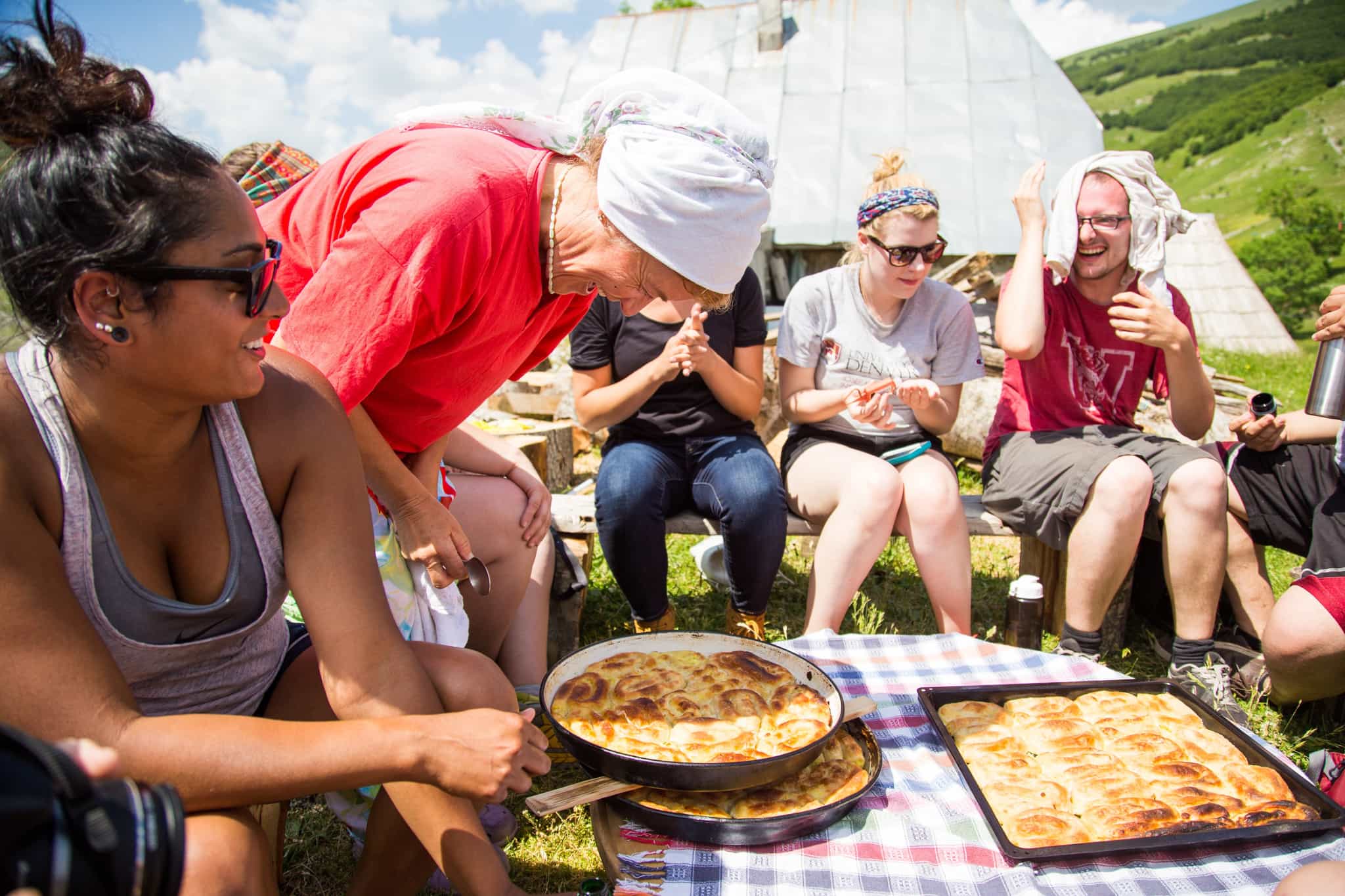 Group enjoying a homemade Bosnian lunch
