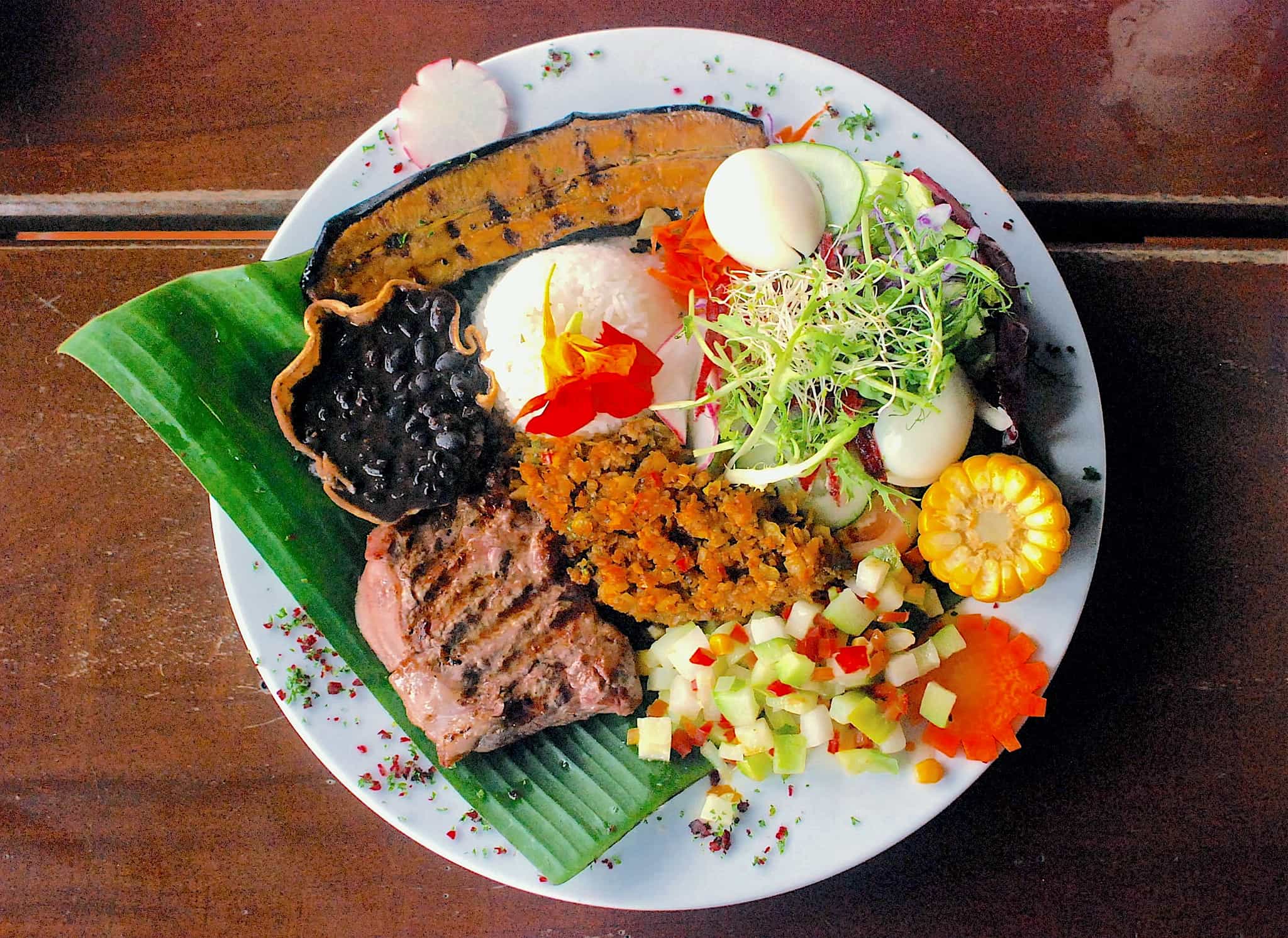 Typical Costa Rican dish of Casados a mixture of refried beans, vegetables and rice with tortilla