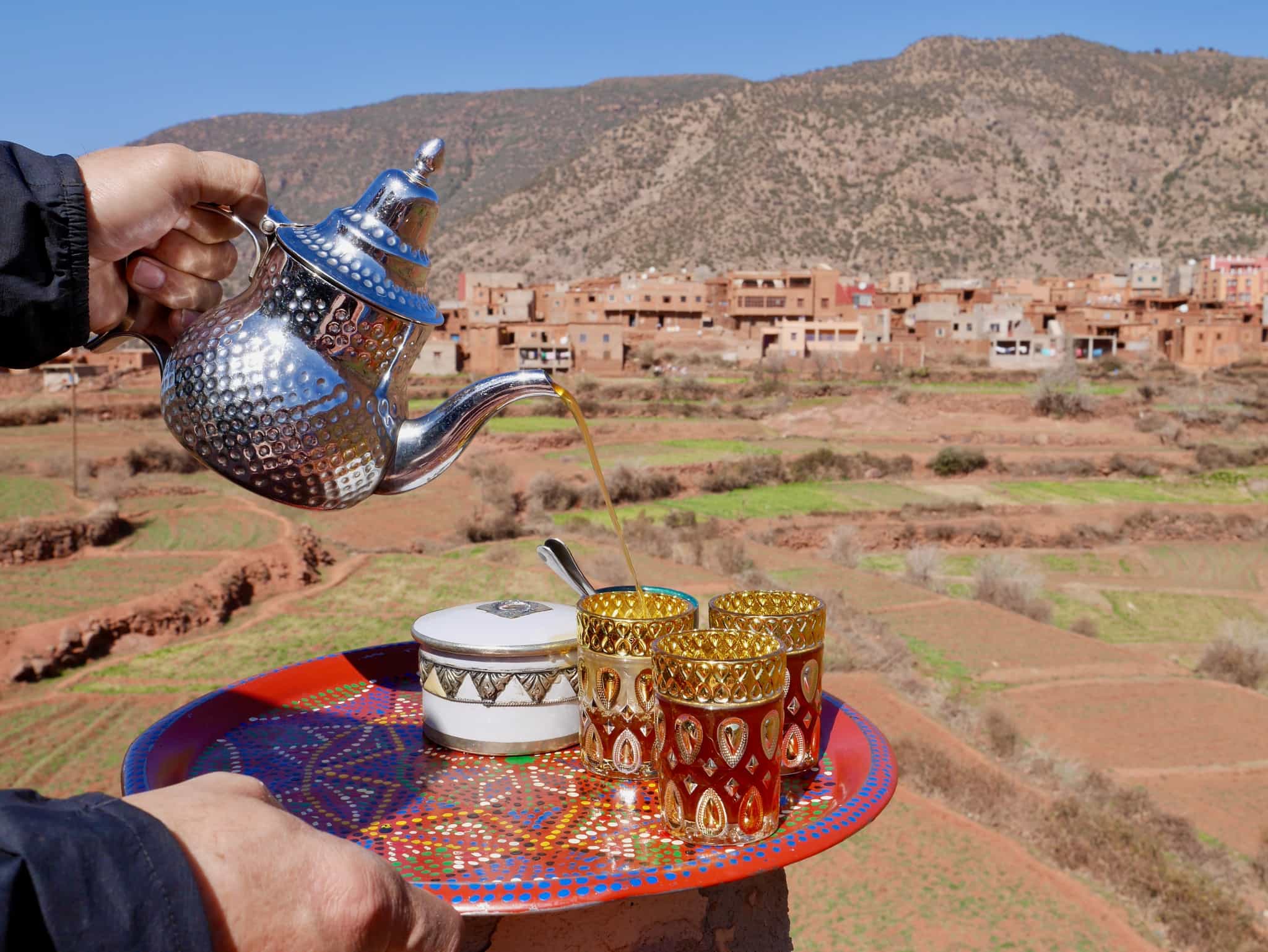 Pouring Moroccan tea in a mountain village in the Atlas Mountains
