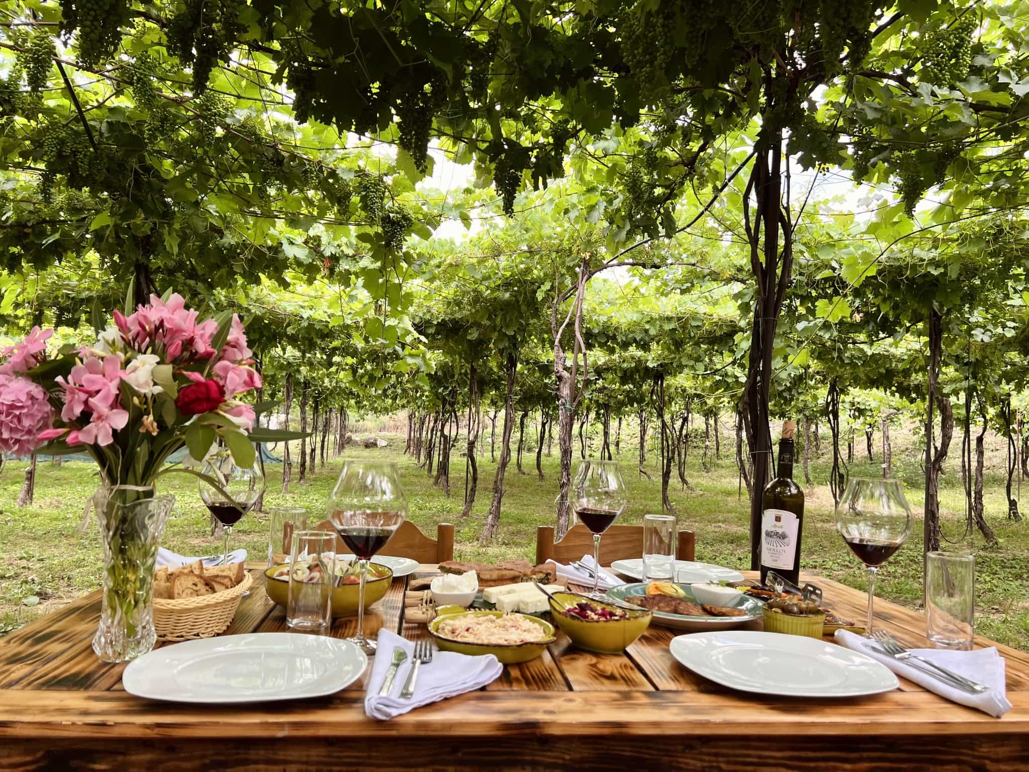 Table with food and wine at Alpeta Winery, Albania