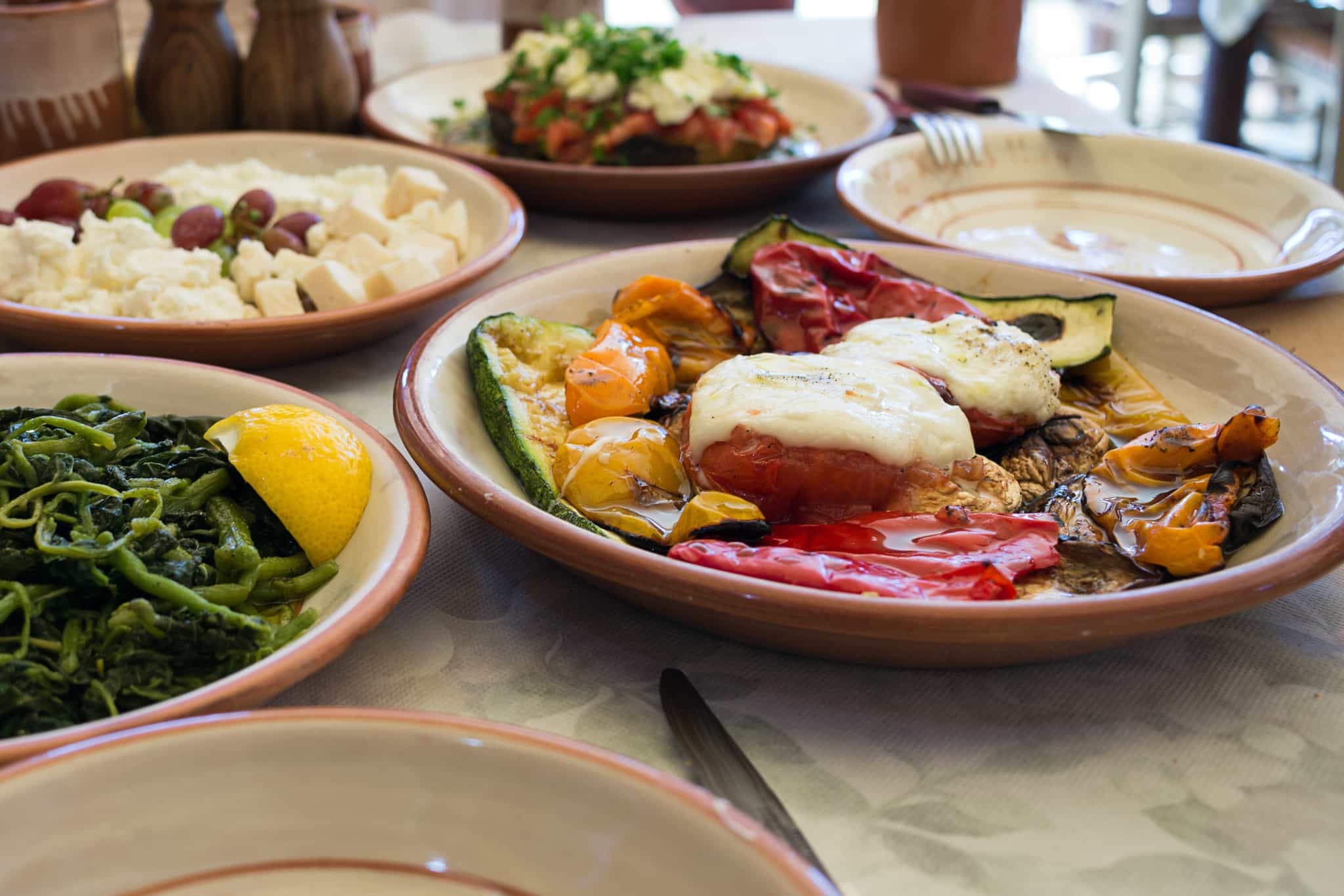 A spread of traditional Greek food in a taverna in Greece.